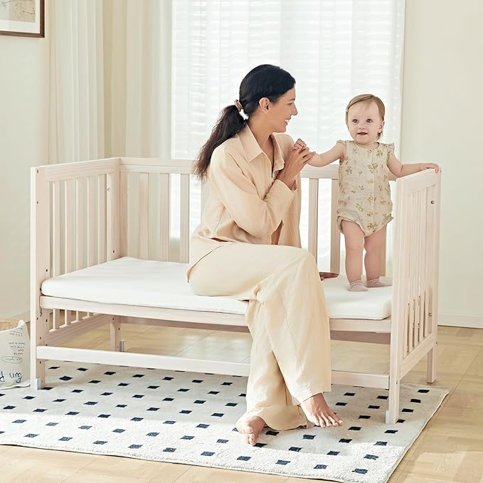EvoNest Baby Crib, 6 in 1 Convertible Mini Crib with Wheels, 100% New Zealand Solid Wood Growing Bed, 4 Adjustable Mattress Height,Washed Natural