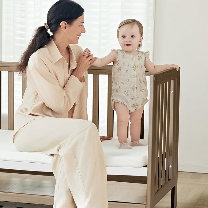 EvoNest Baby Crib, 6 in 1 Convertible Mini Crib with Wheels, 100% New Zealand Wood Growing Bed, 4 Adjustable Mattress Height,Walnut Brown (Walnut Brown)
